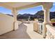 A scenic balcony with decorative pillars, a railing and captivating views of mountains at 11809 S Montezuma Ct, Phoenix, AZ 85044