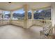 Spacious balcony with pillars, railing, seating, and views of the desert mountains at 11809 S Montezuma Ct, Phoenix, AZ 85044