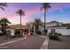 Beautiful desert home with a terracotta roof, palm trees, and well-maintained grounds at 11809 S Montezuma Ct, Phoenix, AZ 85044