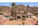 Stunning home featuring desert landscaping, terracotta tile roof, and mountain views at 11809 S Montezuma Ct, Phoenix, AZ 85044