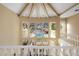 A grand foyer with high ceilings, a view of the backyard, and a grand staircase at 11809 S Montezuma Ct, Phoenix, AZ 85044