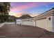 A spacious three-car garage offers ample parking and storage space with mountain views on the horizon at 11809 S Montezuma Ct, Phoenix, AZ 85044