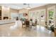 Spacious living room with fireplace, high ceilings, and seamless indoor-outdoor flow to the pool at 11809 S Montezuma Ct, Phoenix, AZ 85044