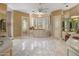 A spacious main bathroom with a bathtub and a large window overlooking the outdoors at 11809 S Montezuma Ct, Phoenix, AZ 85044