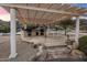 Outdoor kitchen and dining area under a pergola, perfect for entertaining with a view at 11809 S Montezuma Ct, Phoenix, AZ 85044