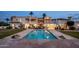 A backyard showcasing a sparkling pool, patios, and a well-maintained yard at 11809 S Montezuma Ct, Phoenix, AZ 85044