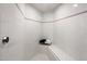 Bright, clean shower with white tiled walls and a built-in bench at 11809 S Montezuma Ct, Phoenix, AZ 85044
