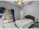 Light blue bedroom featuring a ceiling fan, carpet, and private patio at 12006 E Yucca St, Scottsdale, AZ 85259
