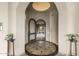 Elegant foyer with arched doorway leading to the outside patio at 12006 E Yucca St, Scottsdale, AZ 85259