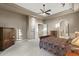 Spacious bedroom featuring tray ceilings, carpet flooring, and ensuite bathroom at 12006 E Yucca St, Scottsdale, AZ 85259