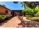 Inviting brick patio with comfortable seating and lush landscaping, perfect for outdoor relaxation at 1246 E Cambridge Ave, Phoenix, AZ 85006
