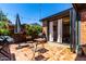 Inviting backyard patio featuring a tiled floor, comfortable seating, string lights, and access to the house at 1246 E Cambridge Ave, Phoenix, AZ 85006