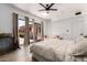 Bright bedroom featuring sliding glass doors leading to the backyard and a ceiling fan at 1246 E Cambridge Ave, Phoenix, AZ 85006