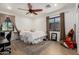 Comfortable bedroom with a ceiling fan, and a view from the window at 1246 E Cambridge Ave, Phoenix, AZ 85006