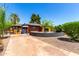Charming brick home featuring a well-kept front yard with mature trees and a spacious driveway at 1246 E Cambridge Ave, Phoenix, AZ 85006