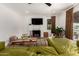 Bright living room with a fireplace, television, and comfortable seating at 1246 E Cambridge Ave, Phoenix, AZ 85006
