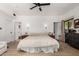 Spacious bedroom featuring hardwood floors, a ceiling fan, and natural light at 1246 E Cambridge Ave, Phoenix, AZ 85006