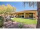 Relaxing backyard with green grass, covered patio, and outdoor seating perfect for entertaining guests at 12690 S 184Th Ave, Goodyear, AZ 85338