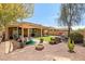 Inviting backyard featuring desert landscaping, patio seating, a fire pit, and a shaded pergola at 12690 S 184Th Ave, Goodyear, AZ 85338