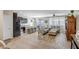 Bright, open-concept living space with tile flooring, modern furnishings, and access to the outdoor patio at 12690 S 184Th Ave, Goodyear, AZ 85338