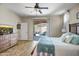Serene main bedroom with patio access, neutral tones, and decorative furnishings for a relaxing retreat at 12690 S 184Th Ave, Goodyear, AZ 85338