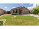 Attractive single-level home with well-kept lawn and a neutral-colored exterior at 137 W Del Rio St, Gilbert, AZ 85233