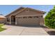 Single-story home boasting a two-car garage and neat front yard landscaping at 137 W Del Rio St, Gilbert, AZ 85233