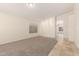 Spacious living room offering carpeted floors, tile flooring near the entry, and bright, neutral walls at 137 W Del Rio St, Gilbert, AZ 85233