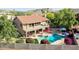 Aerial view of a two-story house featuring a swimming pool, patio, balcony, and landscaped backyard at 14034 S 34Th Pl, Phoenix, AZ 85044