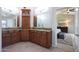 Dual sink bathroom vanity featuring granite countertops and dark wood cabinetry at 14034 S 34Th Pl, Phoenix, AZ 85044