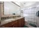 Well-lit bathroom showcasing a double sink vanity with granite countertops at 14034 S 34Th Pl, Phoenix, AZ 85044