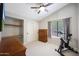 Bright bedroom with neutral tones, complemented by a ceiling fan and natural light at 14034 S 34Th Pl, Phoenix, AZ 85044