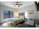 Inviting bedroom with a comfortable bed, stylish decor, and a functional workspace by the window at 14034 S 34Th Pl, Phoenix, AZ 85044