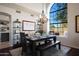 Bright dining room with large arched windows, chandelier, and seating for six, perfect for entertaining at 14034 S 34Th Pl, Phoenix, AZ 85044