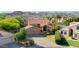 Beautiful home with a tile roof, three-car garage, and lush landscaping in front yard at 14034 S 34Th Pl, Phoenix, AZ 85044