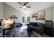 Inviting living room featuring a cozy sofa, stylish rug, and ample natural light at 14034 S 34Th Pl, Phoenix, AZ 85044