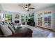 Cozy living room featuring a fireplace, comfortable seating, and views of the outdoor pool area at 14034 S 34Th Pl, Phoenix, AZ 85044