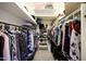 Walk-in closet with organized shelves and ample hanging space for clothing and accessories at 14034 S 34Th Pl, Phoenix, AZ 85044