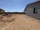 Desert landscaped backyard features a block wall, view fencing and mountain views at 15785 W Cheryl Dr, Waddell, AZ 85355