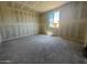 Unfurnished bedroom with large window, ready for customization at 15785 W Cheryl Dr, Waddell, AZ 85355