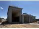 New house showing exterior stucco construction and an oversized two-car garage at 15785 W Cheryl Dr, Waddell, AZ 85355
