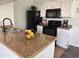 Well-equipped kitchen with granite counters and black appliances at 16013 S Desert Foothills Pkwy # 2056, Phoenix, AZ 85048