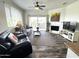 Inviting living room with wood floors, fireplace, and sliding glass doors to the outside patio at 16013 S Desert Foothills Pkwy # 2056, Phoenix, AZ 85048