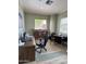 Functional office space with a large desk, computer setup, bookcase, and small table with chairs for meetings at 16013 S Desert Foothills Pkwy # 2056, Phoenix, AZ 85048