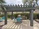Poolside grilling station complete with a stainless steel BBQ and outdoor seating area at 16013 S Desert Foothills Pkwy # 2056, Phoenix, AZ 85048