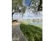 Scenic lakeside view with a park bench, a paved walking path, and neighborhood in the distance at 16013 S Desert Foothills Pkwy # 2056, Phoenix, AZ 85048