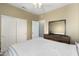 Neutral bedroom with bed, ceiling fan, double closets, and ensuite at 16246 W Talara Way, Surprise, AZ 85374