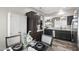 Charming dining area with a view to the kitchen and ample storage cabinetry at 16246 W Talara Way, Surprise, AZ 85374