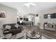Inviting living room with wood flooring, comfortable seating, and an open layout at 16246 W Talara Way, Surprise, AZ 85374