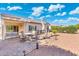 Outdoor patio featuring a dining area, BBQ, and desert landscaping at 16246 W Talara Way, Surprise, AZ 85374